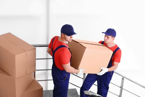 Careful unpacking and room setup in a Mayfair apartment