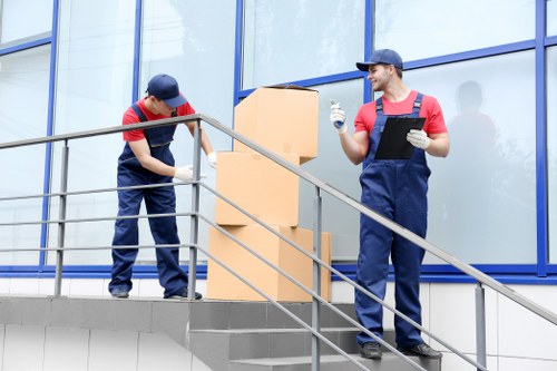 Piano movers planning a careful removal in a Mayfair property