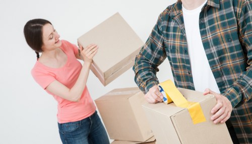 Careful packing of delicate household items for a Mayfair move