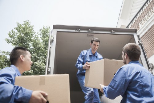 Movers handling furniture in a luxury apartment building in Mayfair