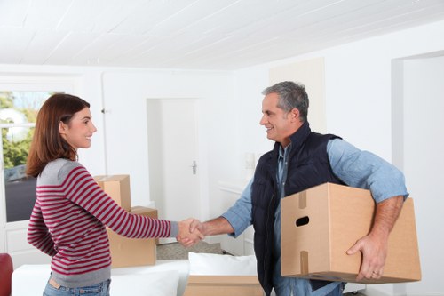 Professional movers transporting boxes in central London