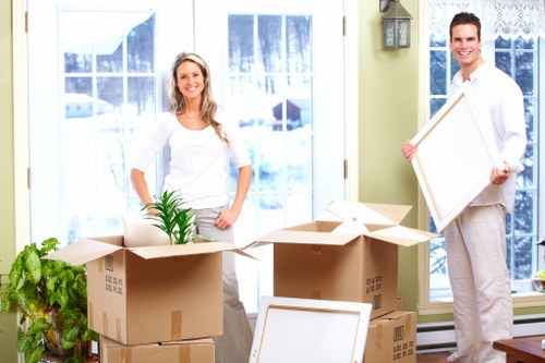 Fragile household items being packed securely for transport